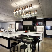 View of contemporary kitchen with lighting feature, black ceiling, interior design, table, gray