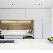 View of contemporary kitchen with white cabinetry, wooden countertop, interior design, kitchen, product design, white