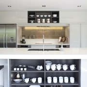 View of contemporary kitchen with white cabinetry, wooden countertop, interior design, kitchen, white