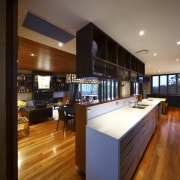 View of kitchen with wooden flooring, dark toned ceiling, flooring, interior design, kitchen, real estate, wood, brown