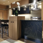 View of contemporary kitchen with wooden features and cabinetry, countertop, cuisine classique, floor, flooring, hardwood, interior design, kitchen, room, wood flooring, brown, black