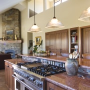 View of kitchen with wooden flooring and island cabinetry, countertop, cuisine classique, interior design, kitchen, real estate, room, brown