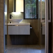 This home was designed by Gerrad Hall, the architecture, bathroom, floor, glass, interior design, room, sink, black, brown