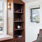 View of wooden shelving in bedroom with white bookcase, cabinetry, furniture, home, interior design, living room, room, shelf, shelving, white, red