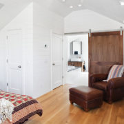 View of bedroom with wooden flooring and brown bedroom, ceiling, floor, flooring, home, interior design, property, real estate, room, suite, wall, wood, wood flooring, white