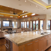 View of kitchen with wooden flooring, stone wall ceiling, countertop, estate, interior design, kitchen, real estate, brown, orange