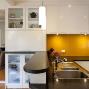 View of contemporary kitchen with white cabinetry, dark ceiling, countertop, interior design, kitchen, room, gray