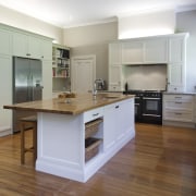 View of contemporary kitchen with wooden flooring and cabinetry, countertop, cuisine classique, floor, flooring, hardwood, interior design, kitchen, laminate flooring, real estate, room, wood, wood flooring, gray