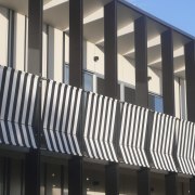 View of exterior with striped feature. - View architecture, brutalist architecture, building, commercial building, corporate headquarters, facade, property, real estate, structure, window, black