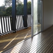 View of doorway out to balcony. - View deck, door, floor, flooring, hardwood, house, outdoor structure, porch, property, real estate, siding, window, wood, wood flooring, black