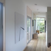 View of interior with wooden flooring and white architecture, daylighting, door, floor, flooring, home, house, interior design, property, real estate, wall, window, wood, wood flooring, gray