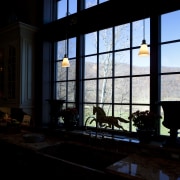 View of kitchen with wooden flooring, high ceilings architecture, building, darkness, daylighting, facade, glass, home, house, light, night, reflection, sky, structure, sunlight, window, black
