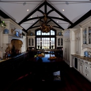 View of kitchen with wooden flooring, high ceilings ceiling, chapel, home, house, interior design, room, window, black, gray
