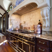 View of kitchen with wooden flooring, high ceilings cabinetry, ceiling, countertop, cuisine classique, flooring, home, interior design, kitchen, room, gray