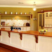 View of kitchen with long wooden island and cabinetry, countertop, cuisine classique, interior design, kitchen, real estate, room, orange