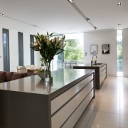 View of kitchen with white flooring and grey countertop, interior design, kitchen, real estate, gray