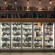 View of refrigeration solution at wine retailer. - bookcase, display case, distilled beverage, liquor store, shelf, shelving, wine cellar, black