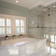 View of bathroom with rectangular bath area and bathroom, countertop, estate, floor, flooring, home, interior design, property, real estate, room, tile, window, gray