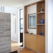 View of contemporary wooden shelving. - View of cabinetry, door, floor, flooring, hardwood, interior design, living room, window, wood, wood flooring, gray