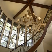 View of stairway. - View of stairway. - architecture, beam, ceiling, chandelier, daylighting, home, interior design, light fixture, lighting, stairs, structure, tourist attraction, window, wood, brown