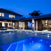 Outdoor night shot of contemporary house and pool architecture, estate, home, house, leisure, lighting, property, real estate, reflection, resort, resort town, sky, swimming pool, villa, window, blue