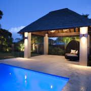 Outdoor night shot of contemporary house and pool backyard, cottage, estate, hacienda, home, house, landscape lighting, leisure, lighting, property, real estate, resort, sky, swimming pool, villa, blue