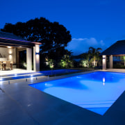 Outdoor night shot of contemporary house and pool architecture, estate, evening, home, house, landscape lighting, leisure, lighting, property, real estate, reflection, residential area, resort, sky, swimming pool, villa, water, blue