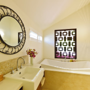 View of contemporary bathroom with round mirror and bathroom, estate, home, interior design, room, orange