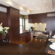 Dark wooden cabinetry, dark coloured benchtop, white walls ceiling, countertop, cuisine classique, interior design, kitchen, real estate, room, red, white