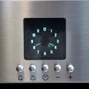 View of kitchen with dark toned cabinets and electronics, home appliance, technology, gray, black