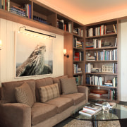 Lounge area with brown sofa and glass table, bookcase, furniture, home, interior design, library, living room, real estate, room, shelf, shelving, orange, brown