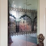 Bathroom doors with black and coloured print, red art, display window, door, glass, interior design, modern art, tourist attraction, wall, window, gray