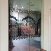 Doors with black and coloured print and red display window, door, glass, interior design, wall, window, gray