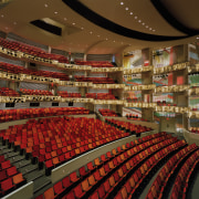 View of theatre with red seating and warm auditorium, grocery store, performing arts center, supermarket, theatre, brown, red