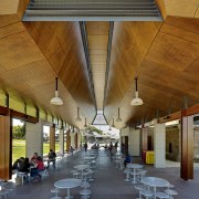 View of outdoor seating area with wooden ceiling. architecture, ceiling, daylighting, interior design, lobby, brown