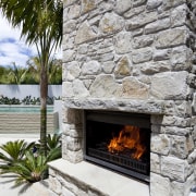 Outdoor fires from Fires By Design include the fireplace, hearth, heat, gray, white