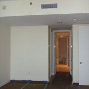 Hall area. - apartment | ceiling | daylighting apartment, ceiling, daylighting, door, floor, flooring, room, wall, gray