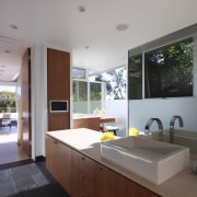 Windows in this master bathroom provide views of architecture, countertop, house, interior design, kitchen, real estate, window, gray