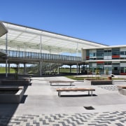 View of courtyard with seating. - View of architecture, building, commercial building, corporate headquarters, metropolitan area, mixed use, real estate, residential area, urban design