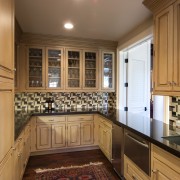 panelled cabinetry, pale wood.wine fridge, integrated fridge, U-shape, cabinetry, countertop, cuisine classique, flooring, interior design, kitchen, room, under cabinet lighting, brown