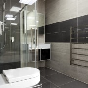 Bathroom with dark tiles, white toilet and glass architecture, bathroom, floor, flooring, glass, interior design, plumbing fixture, product design, room, sink, tile, wall, gray, white, black