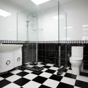 Bathroom with black and white checkered floor, black bathroom, black and white, floor, flooring, interior design, plumbing fixture, public toilet, room, tile, white, black