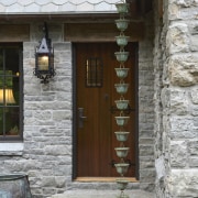 Entrance way with stone cladding. - Entrance way door, facade, house, window, wood, gray