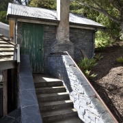 View of stone steps leading to green door architecture, cottage, house, outdoor structure, tree, walkway, wood, black