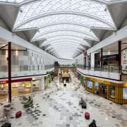 View of light toned interior of mall. - building, daylighting, lobby, metropolitan area, mixed use, shopping mall, gray, white