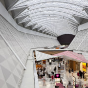 View of light toned interior of mall. - architecture, building, ceiling, daylighting, interior design, lobby, shopping mall, tourist attraction, gray