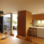 View of kitchen and dining area with wooden architecture, house, interior design, kitchen, real estate, orange, brown