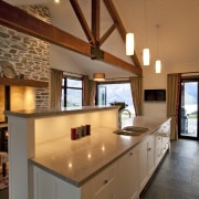 View of kitchen with light toned benchtops and countertop, estate, interior design, kitchen, real estate, room, brown