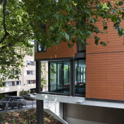 Exterior view of halls of residence. - Exterior architecture, cottage, facade, home, house, leaf, outdoor structure, real estate, residential area, siding, tree, window, wood, brown