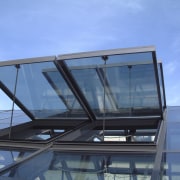 Low angle shot of open windows. - Low architecture, automotive exterior, daylighting, glass, roof, sky, window, teal